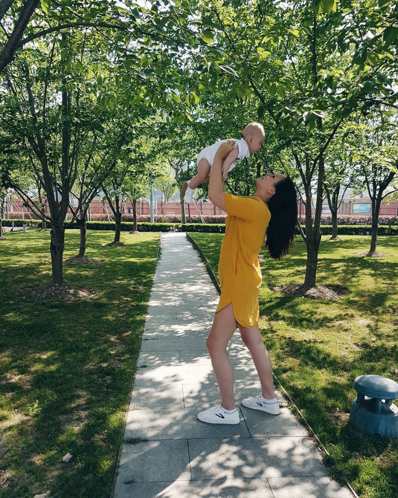 Georgina Wilson playing with her baby