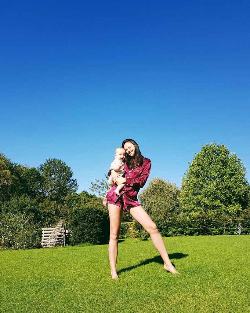 Georgina Wilson carrying her baby