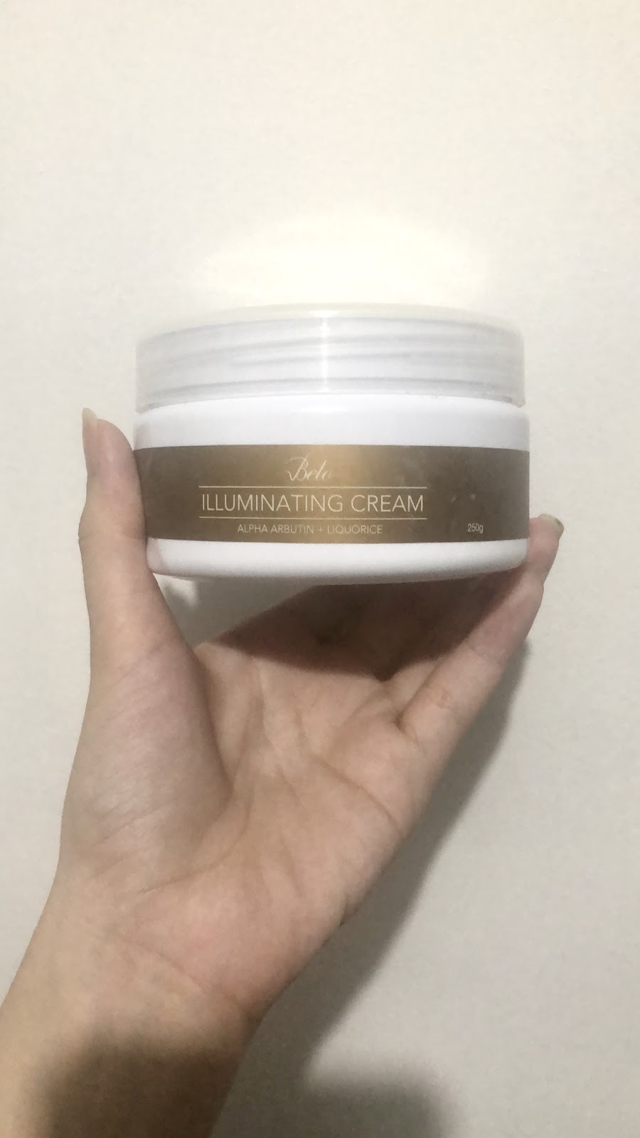 Andrea Lim Holding Belo Rx Illuminating Cream